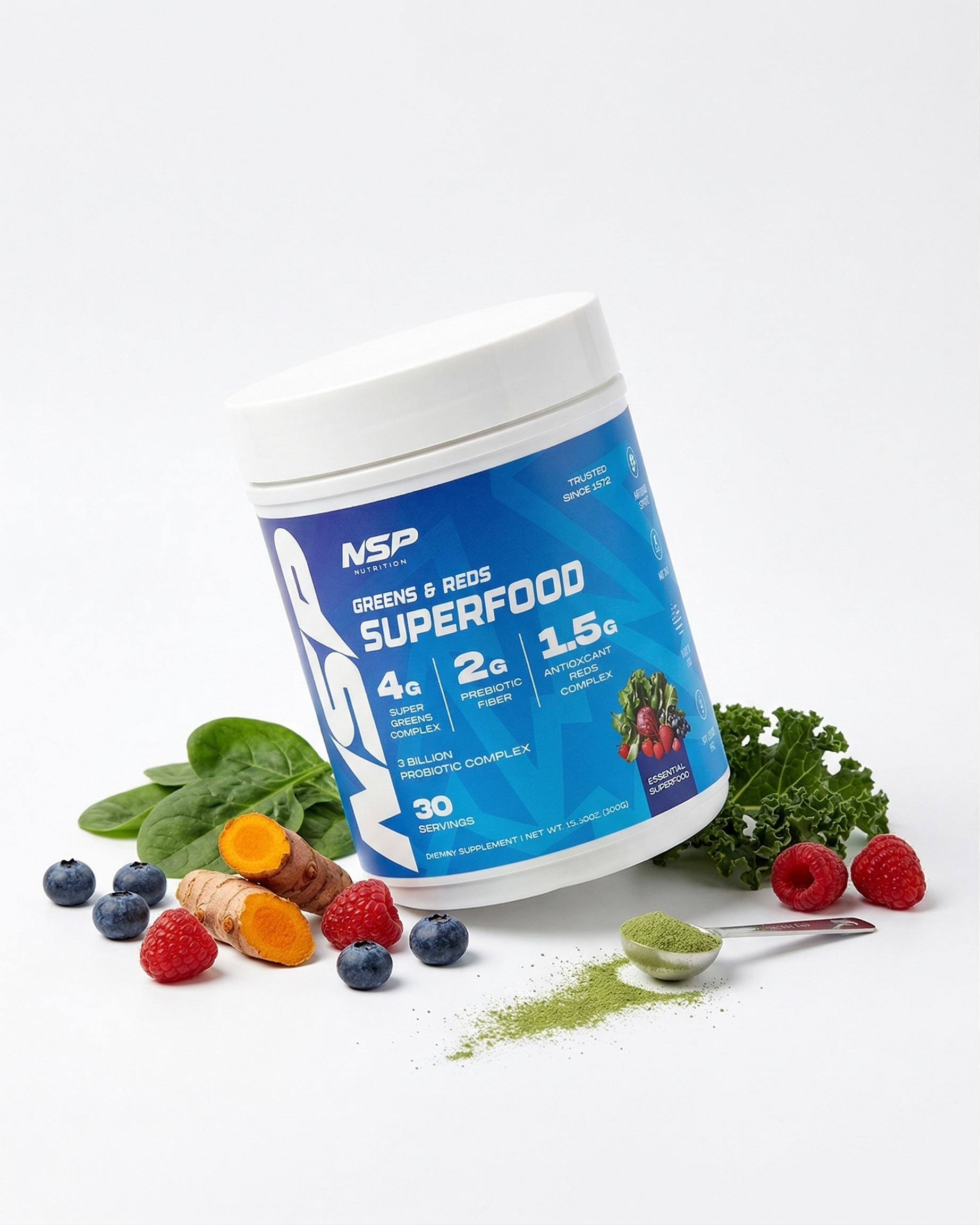 NSP Superhuman Greens & Reds Superfood Powder surrounded by real ingredients — spinach, berries, turmeric, pomegranate, kale and wheatgrass